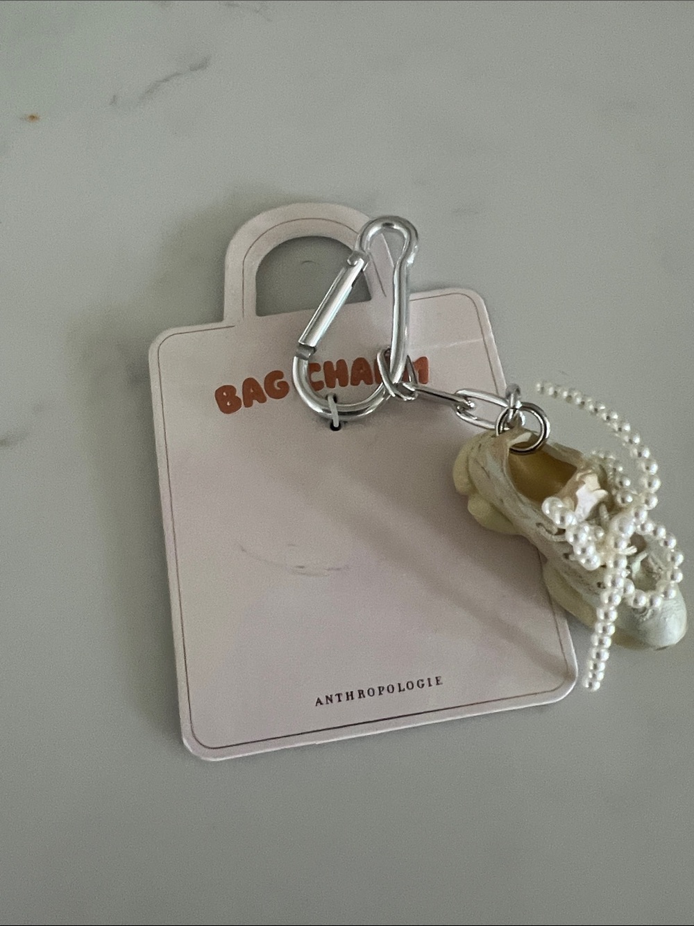 Anthropologie Cream Pearl-Trim Shoe Bag Charm